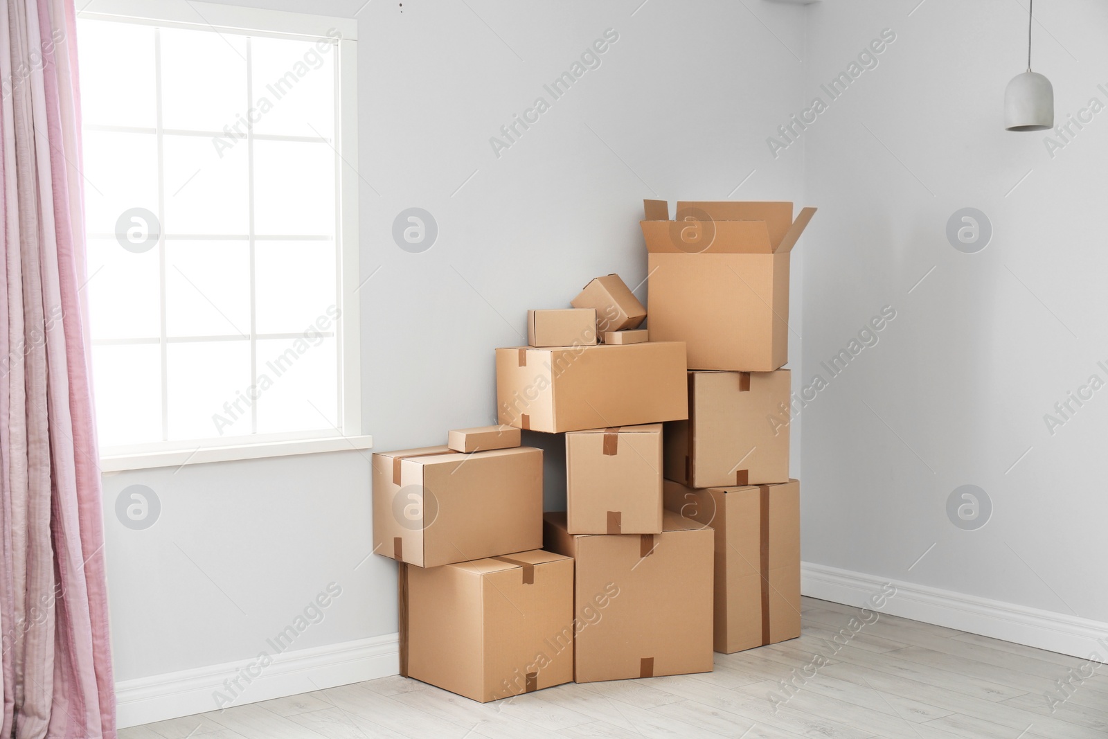 Photo of Cardboard boxes on floor indoors