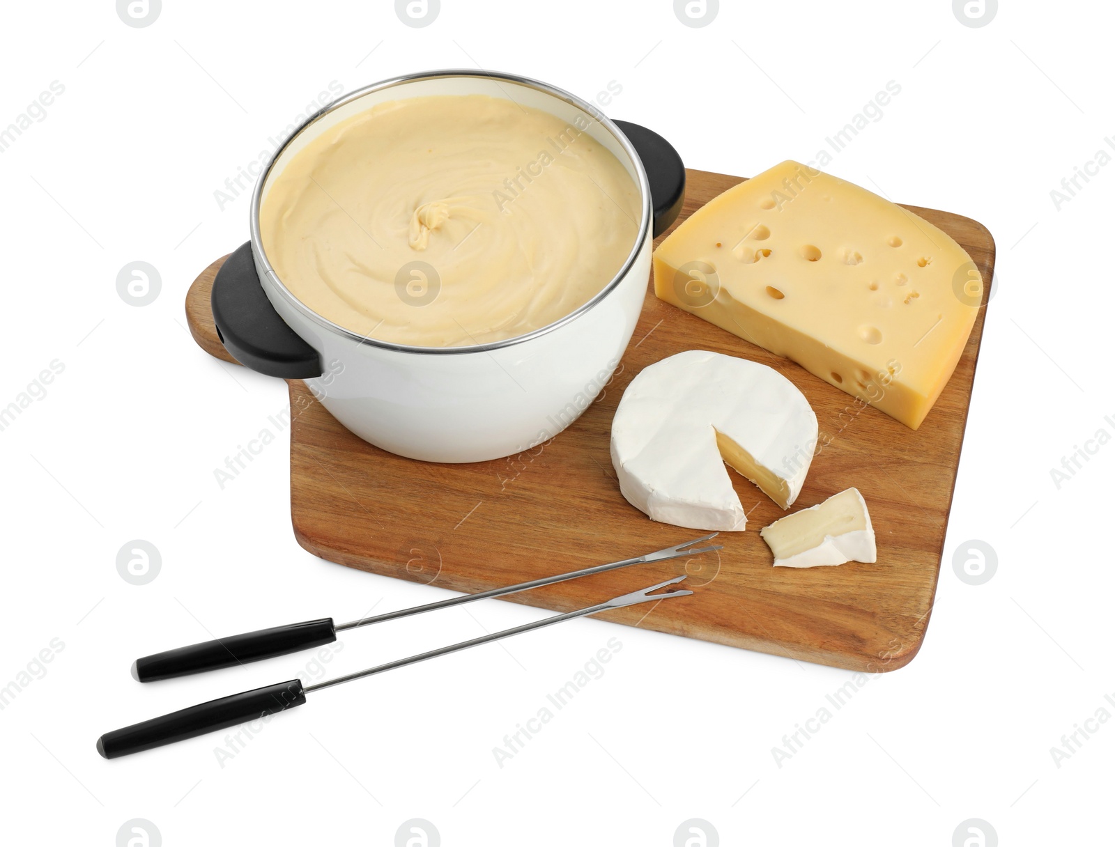 Photo of Fondue with tasty melted cheese, forks and pieces isolated on white