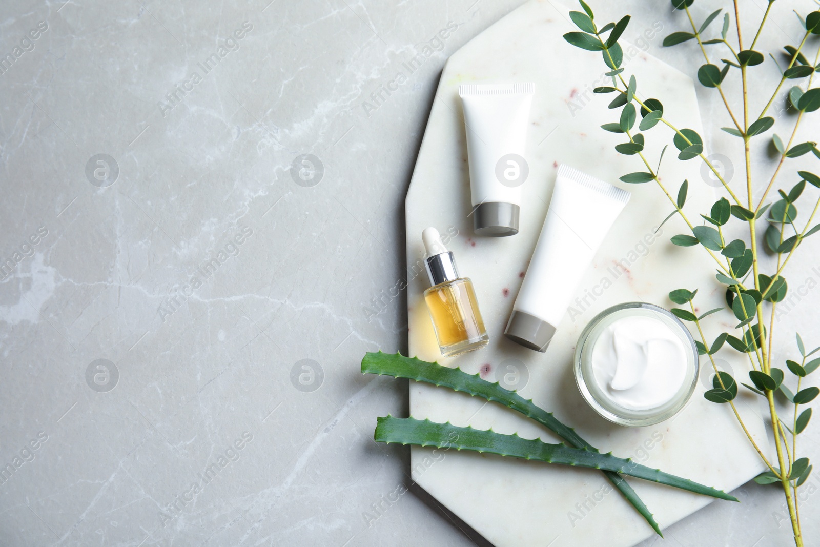 Photo of Flat lay composition with different body care products and space for text on grey background
