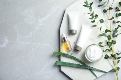 Flat lay composition with different body care products and space for text on grey background