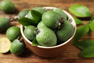 Fresh green feijoa fruits on wooden table, closeup