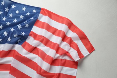 Flag of USA on white table, top view