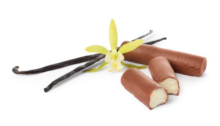 Photo of Glazed curd cheese bars, vanilla pods and flower isolated on white