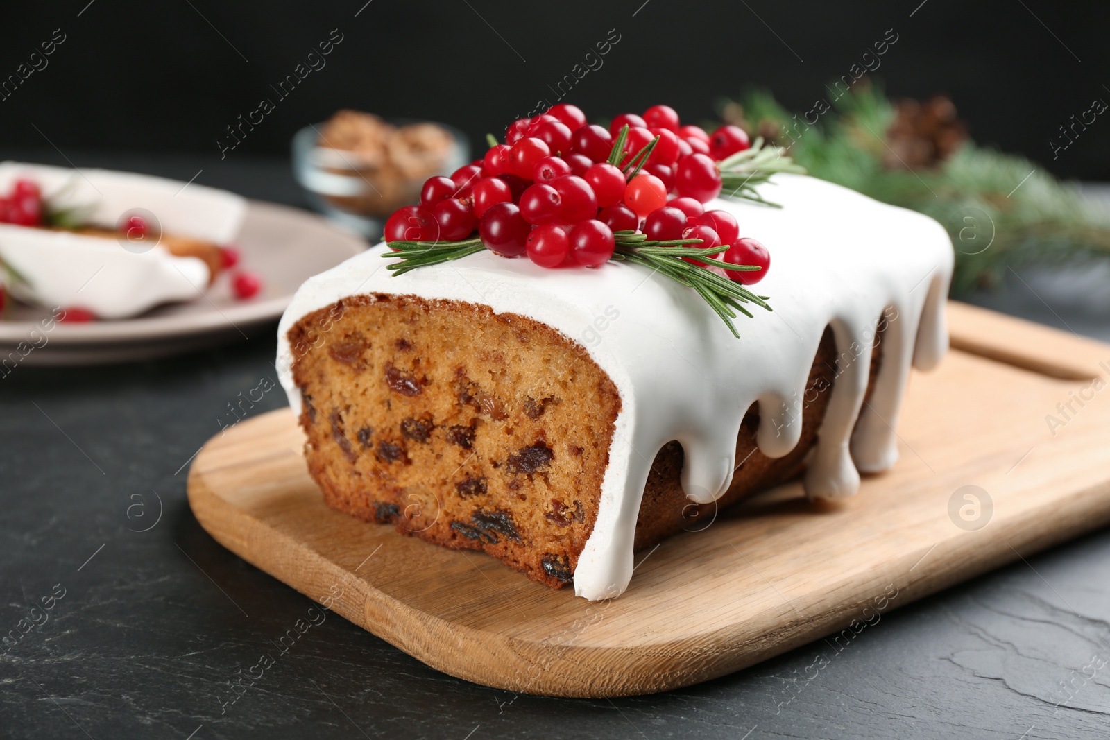 Photo of Traditional Christmas cake on black table. Classic recipe