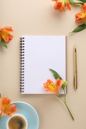 Guest list. Notebook, pen, coffee and beautiful flowers on beige table, flat lay. Space for text