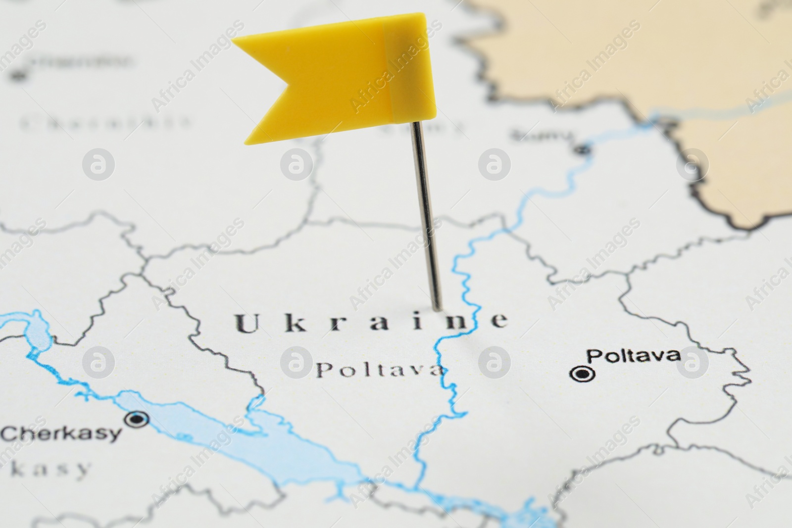 Photo of MYKOLAIV, UKRAINE - NOVEMBER 09, 2020: Contour map of Ukraine with flag push pin, closeup