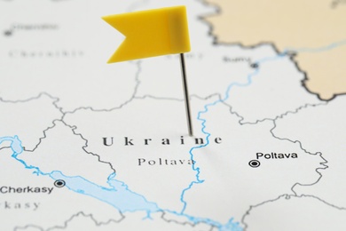 Photo of MYKOLAIV, UKRAINE - NOVEMBER 09, 2020: Contour map of Ukraine with flag push pin, closeup