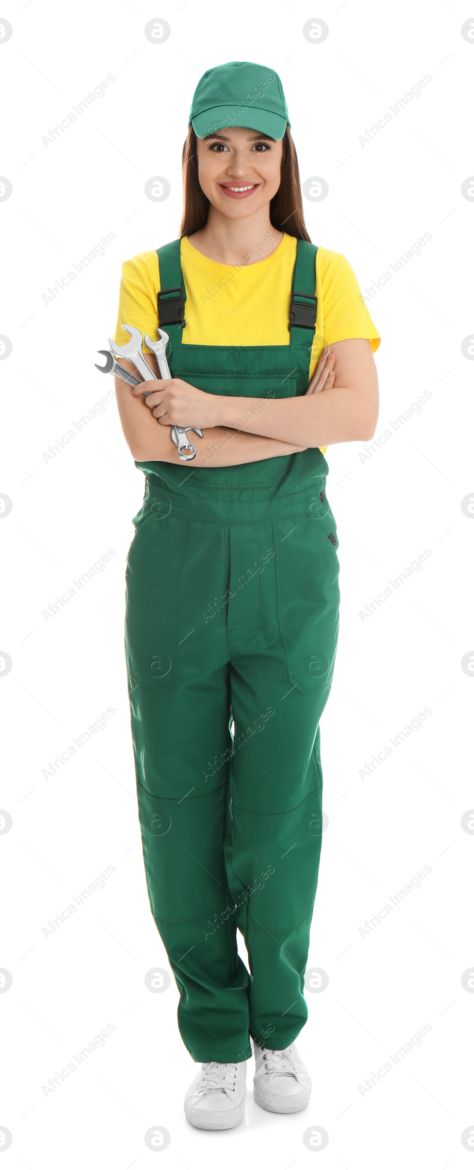 Photo of Full length portrait of professional auto mechanic with wrenches on white background