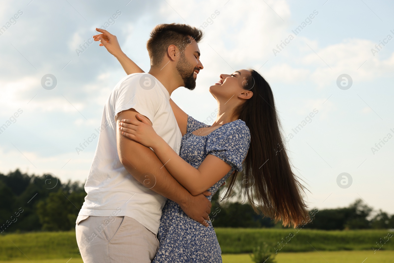 Photo of Romantic date. Beautiful couple spending time together outdoors