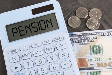 Image of Calculator with word Pension and money on grey table, top view