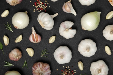 Photo of Flat lay composition with garlic and onion on table