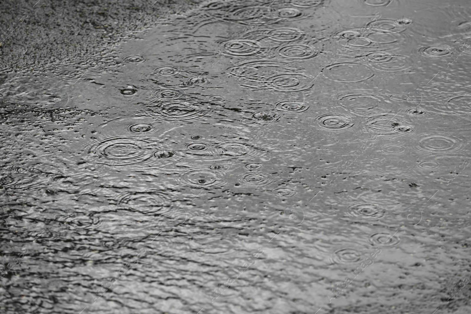 Photo of View of heavy pouring rain on city street