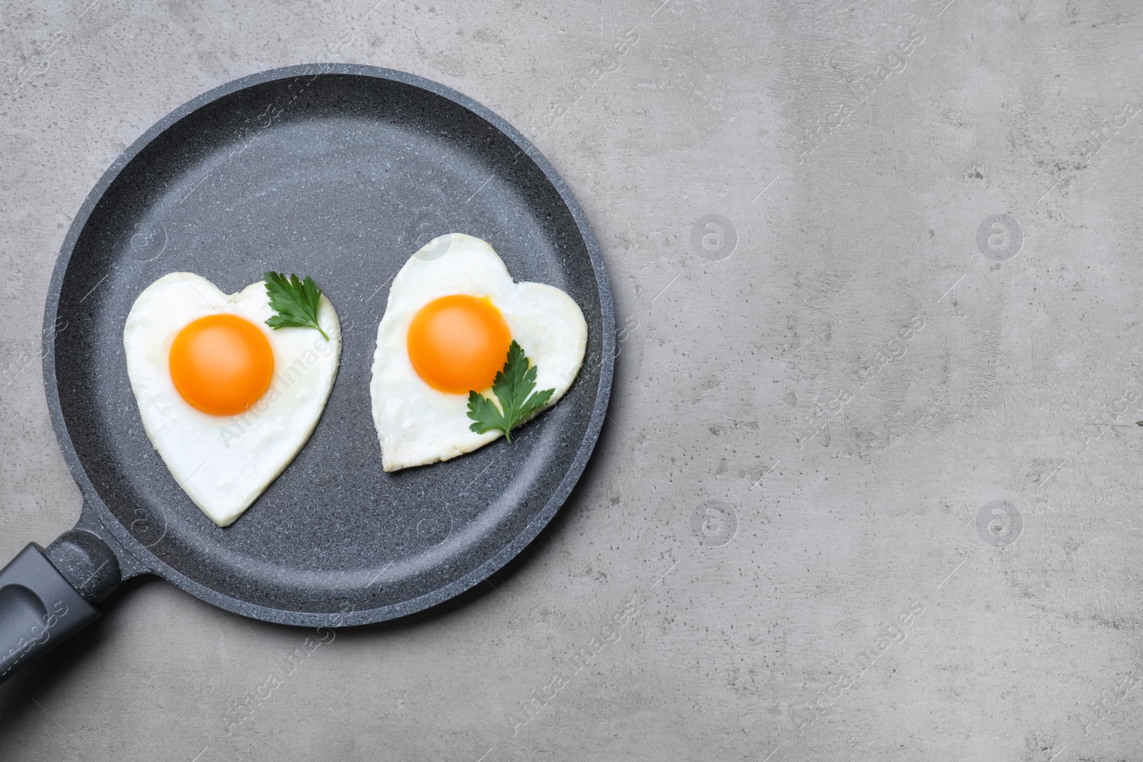 Photo of Romantic breakfast on grey table, top view with space for text. Valentine's day celebration