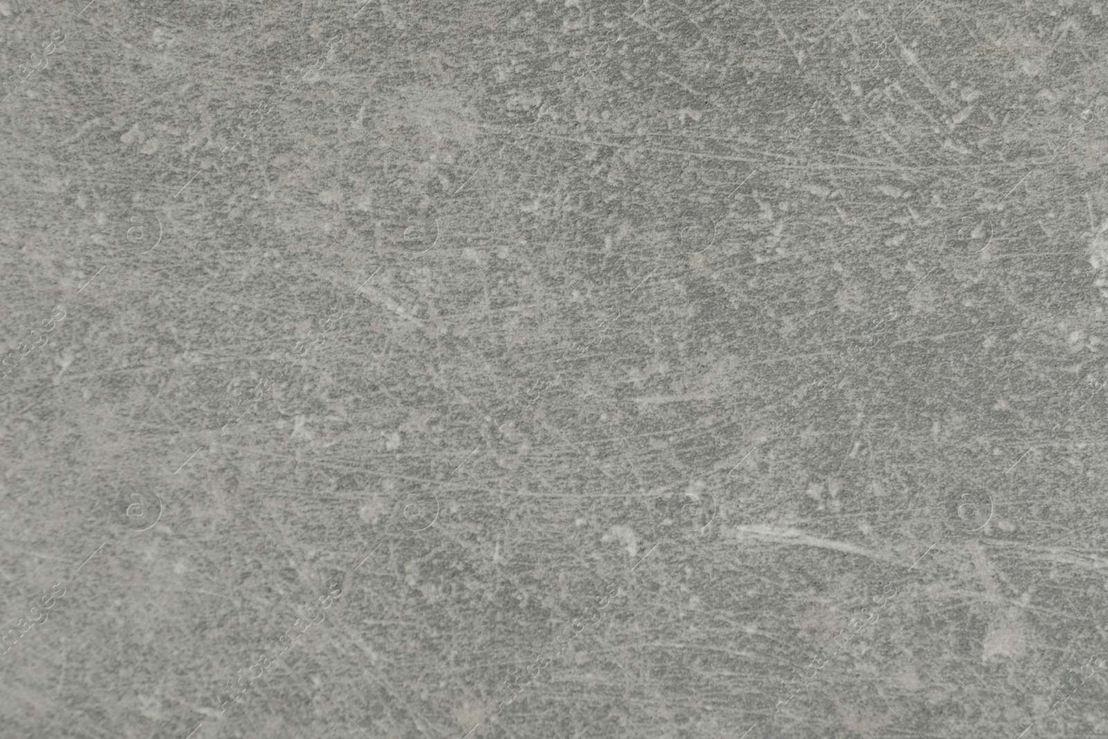 Photo of Texture of light grey stone surface as background, closeup