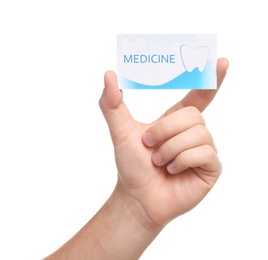 Photo of Man holding business card isolated on white, closeup. Dental medical service