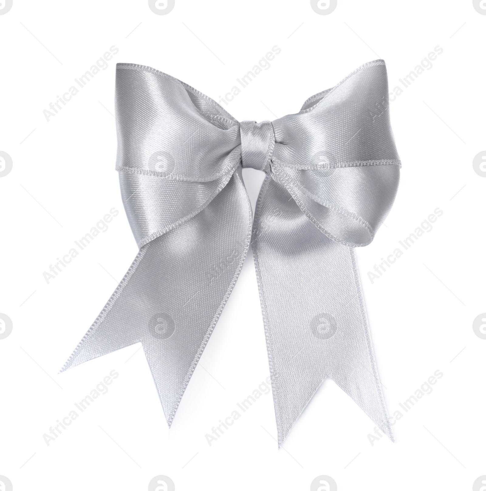 Photo of Silver satin ribbon tied in bow on white background, top view