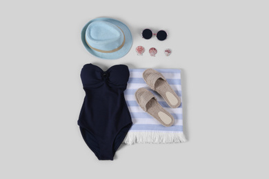 Photo of Flat lay composition with beach accessories on white background