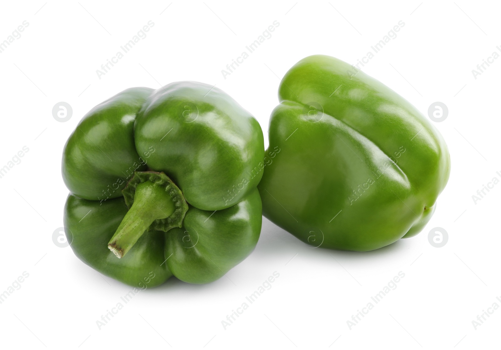 Photo of Fresh ripe green bell peppers isolated on white