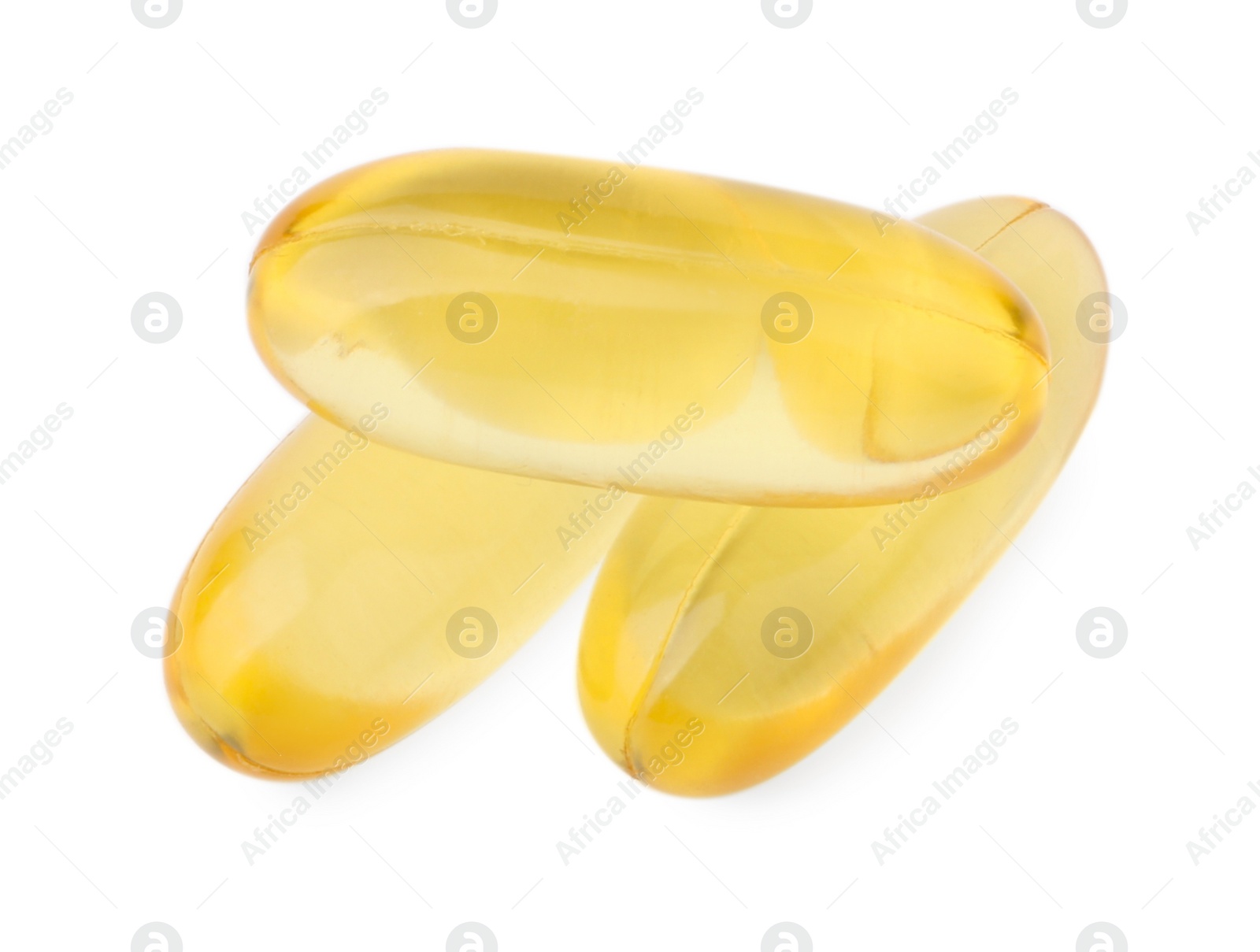 Photo of Yellow vitamin capsules isolated on white, top view