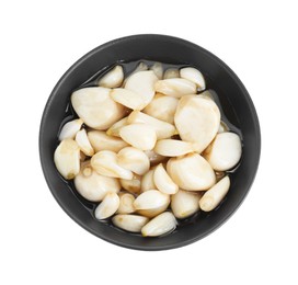 Photo of Peeled garlic cloves with honey in bowl isolated on white, top view