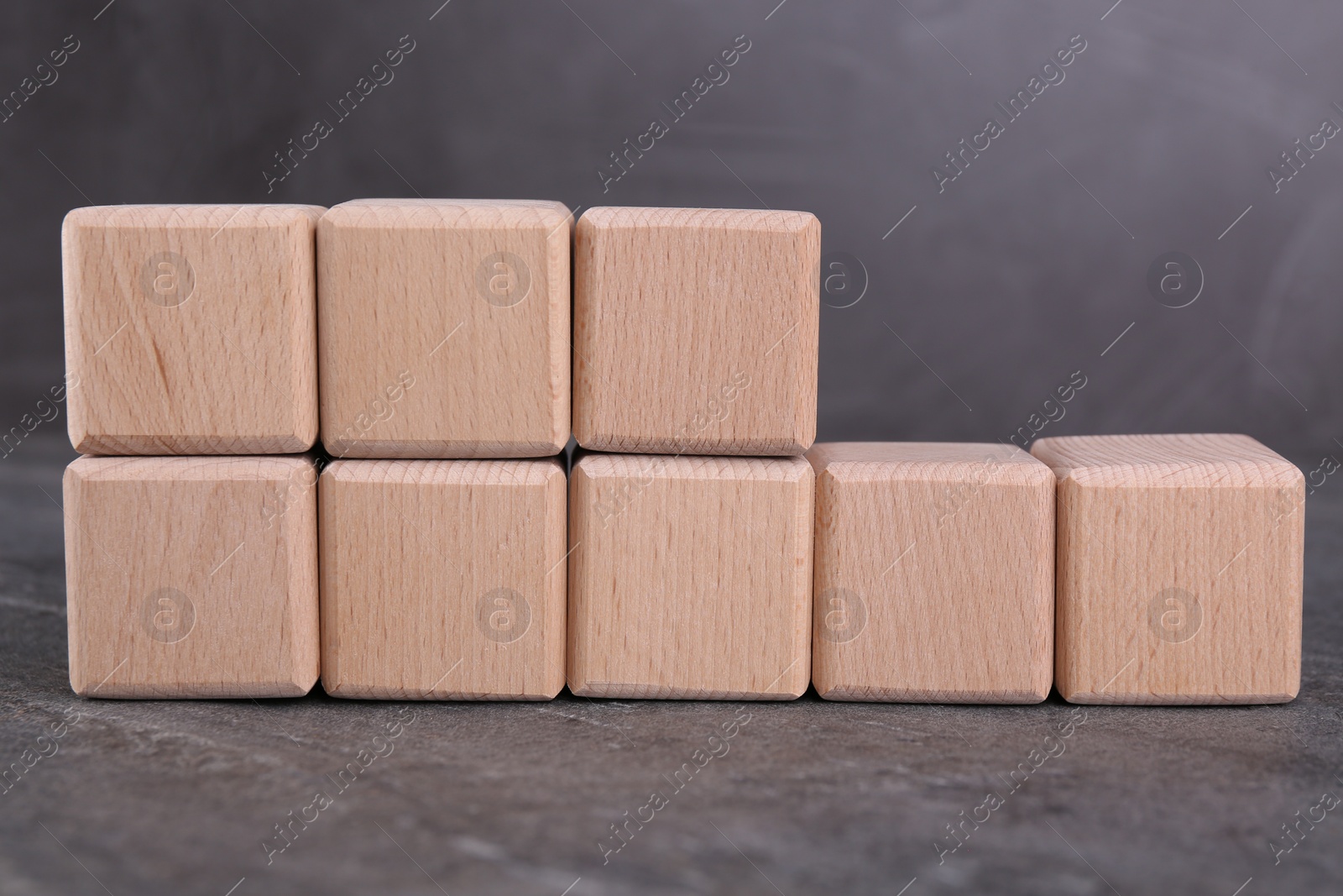 Photo of International Organization for Standardization. Cubes with abbreviation ISO 18001 on gray textured table