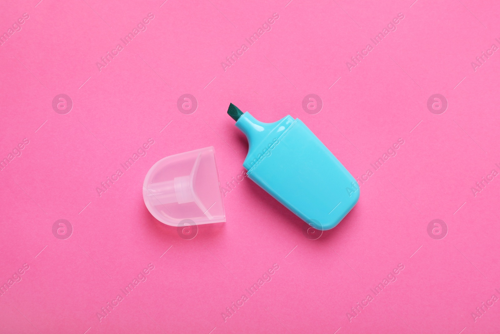 Photo of One marker with cap on pink background, top view