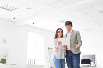 Photo of Young people having business training in office