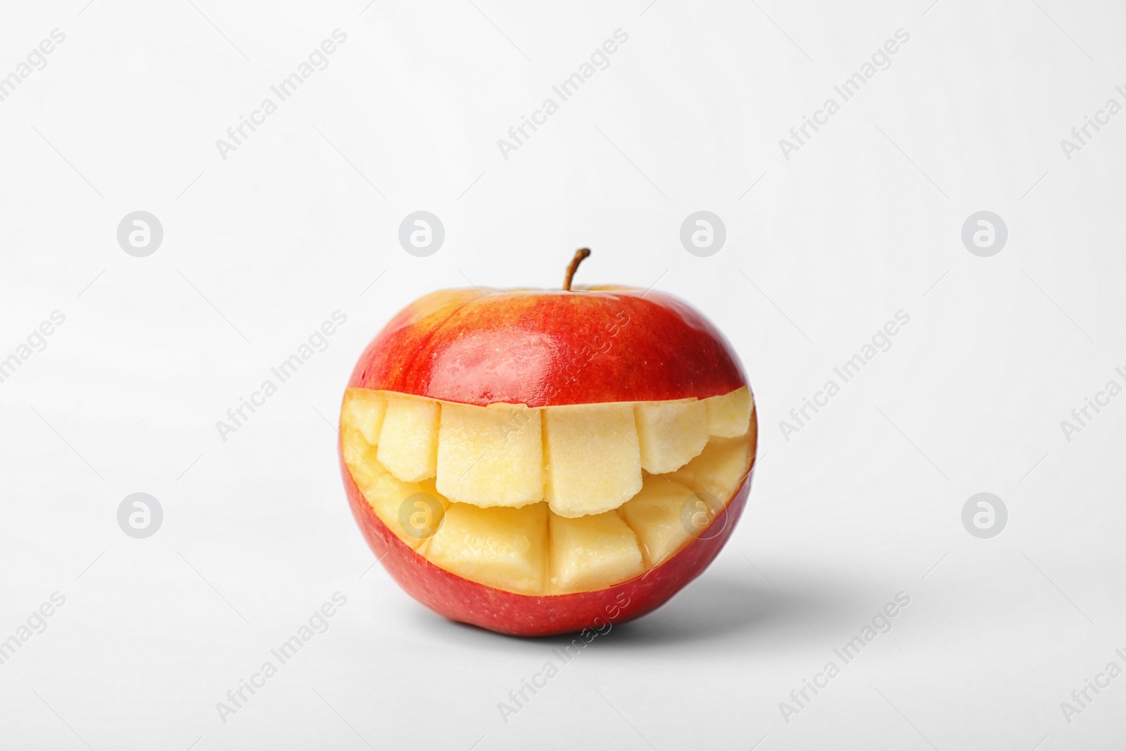 Photo of Funny smiling apple on white background