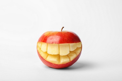 Photo of Funny smiling apple on white background