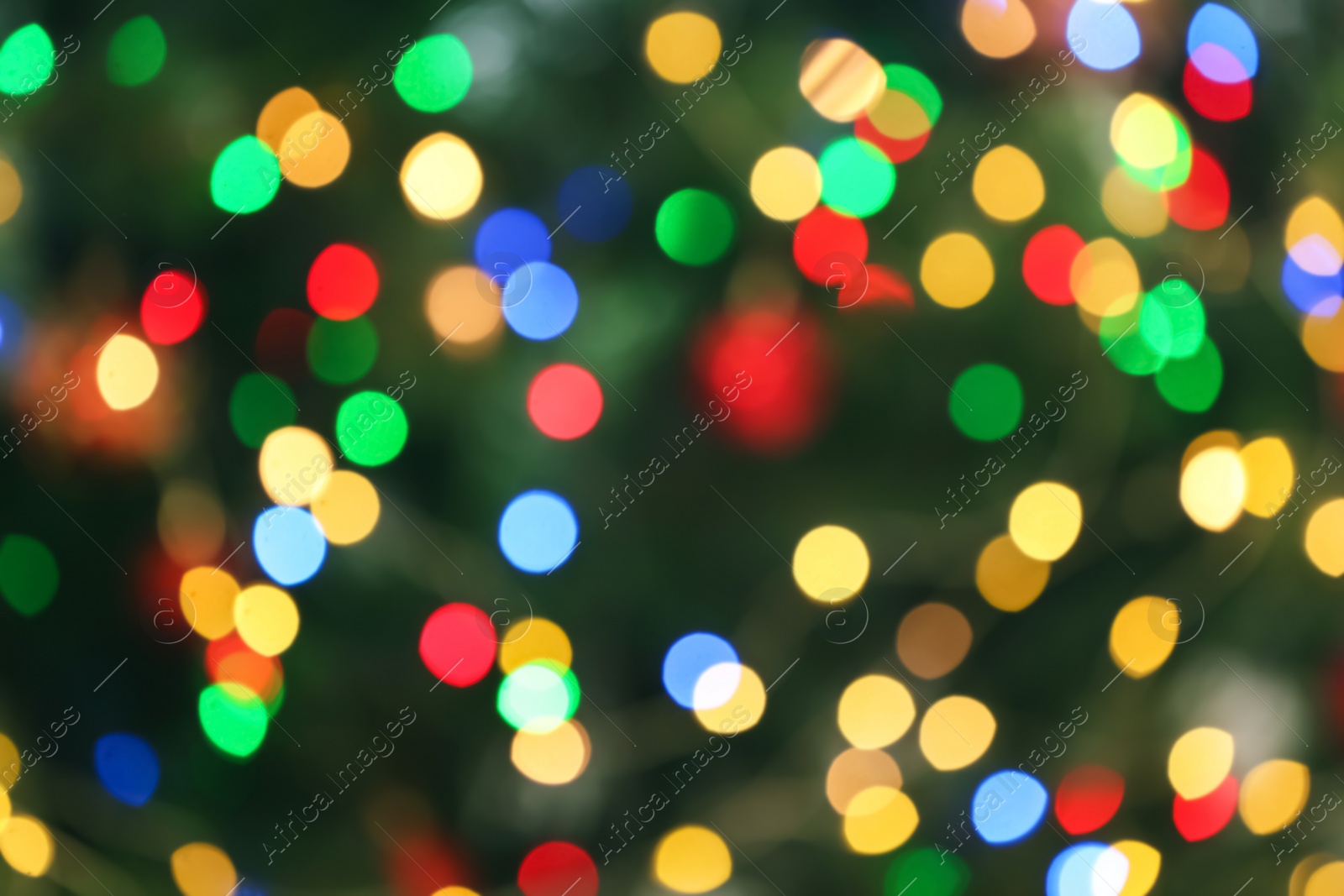 Photo of Blurred view of glowing Christmas lights as background. Festive mood