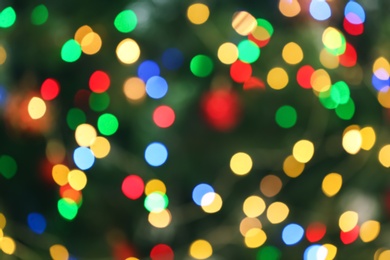 Photo of Blurred view of glowing Christmas lights as background. Festive mood