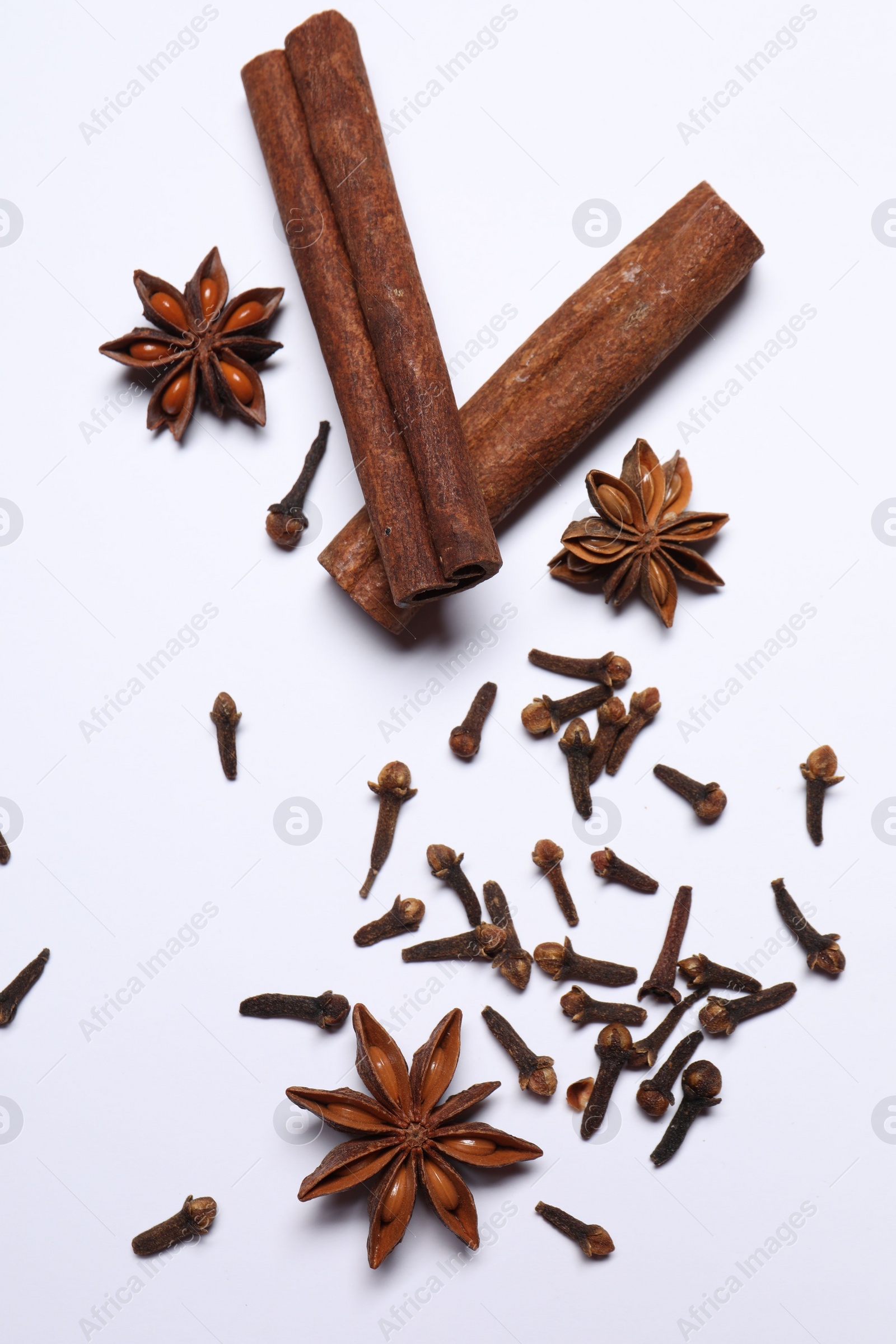 Photo of Different spices on white table, flat lay