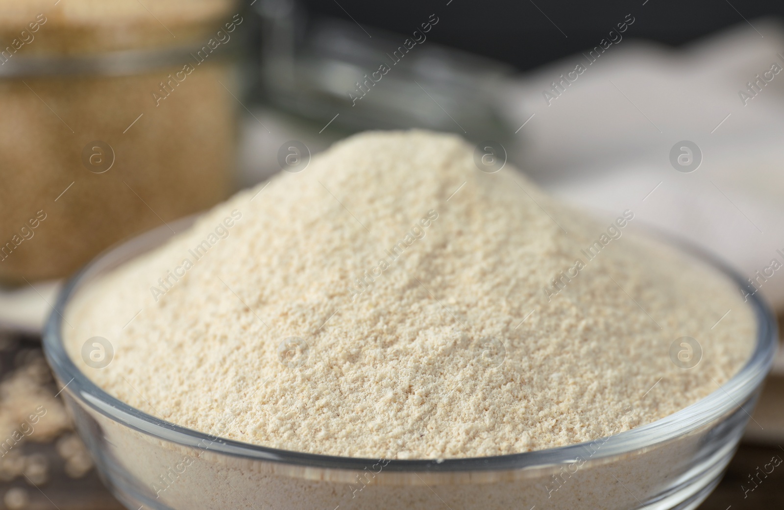 Photo of Glass bowl with quinoa flour, closeup view