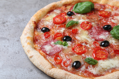 Delicious pizza Diablo on grey table, closeup