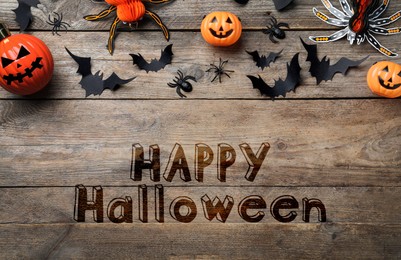 Image of Halloween decor elements on wooden background, flat lay