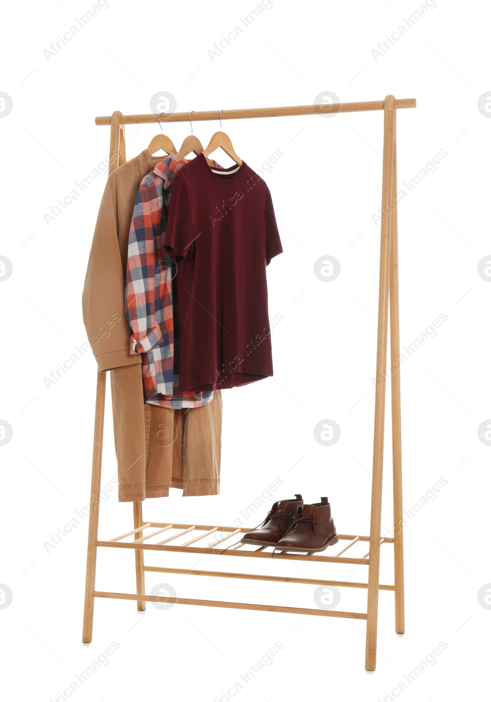 Photo of New wardrobe rack with stylish man's clothes and shoes on white background