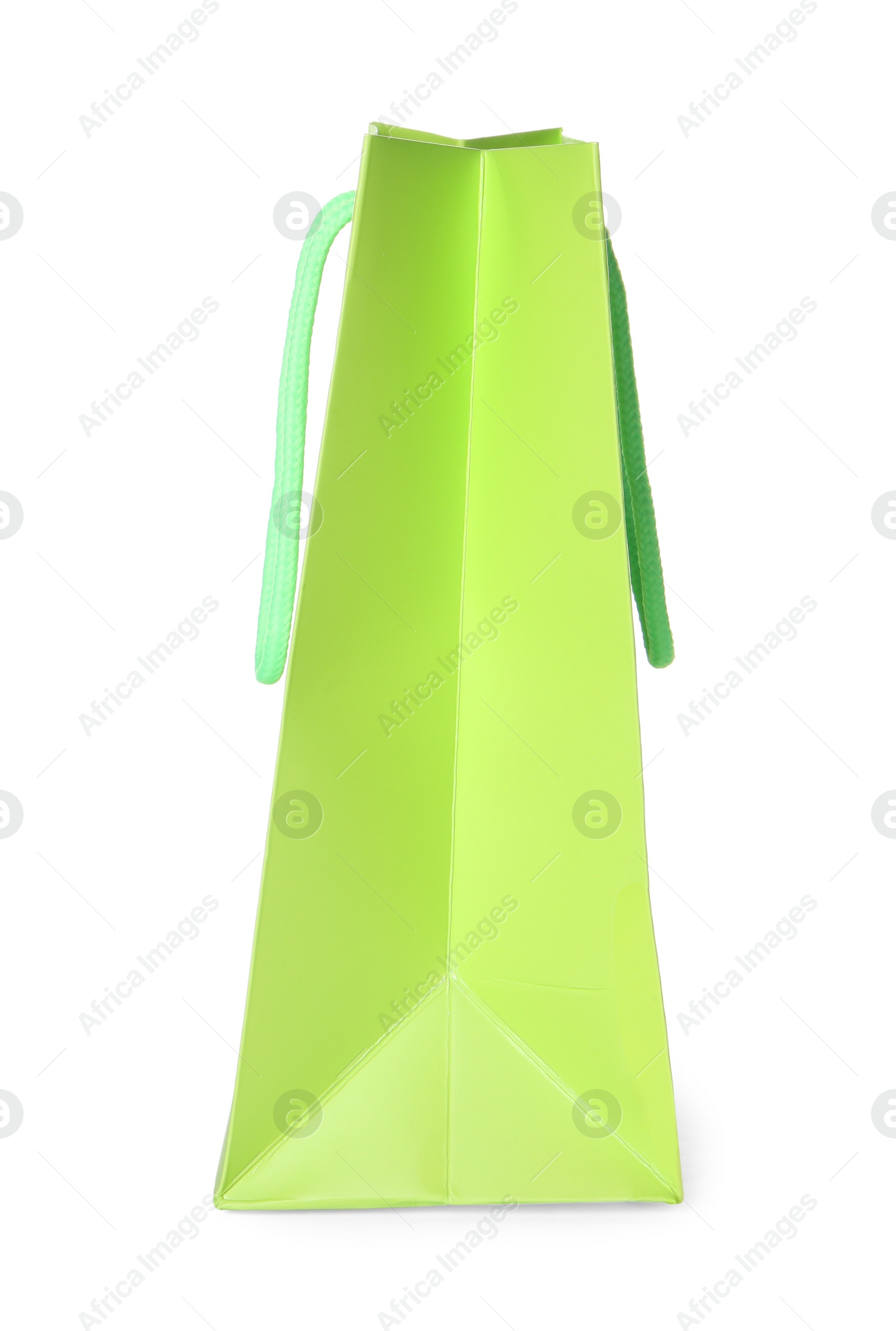 Photo of One green shopping bag isolated on white