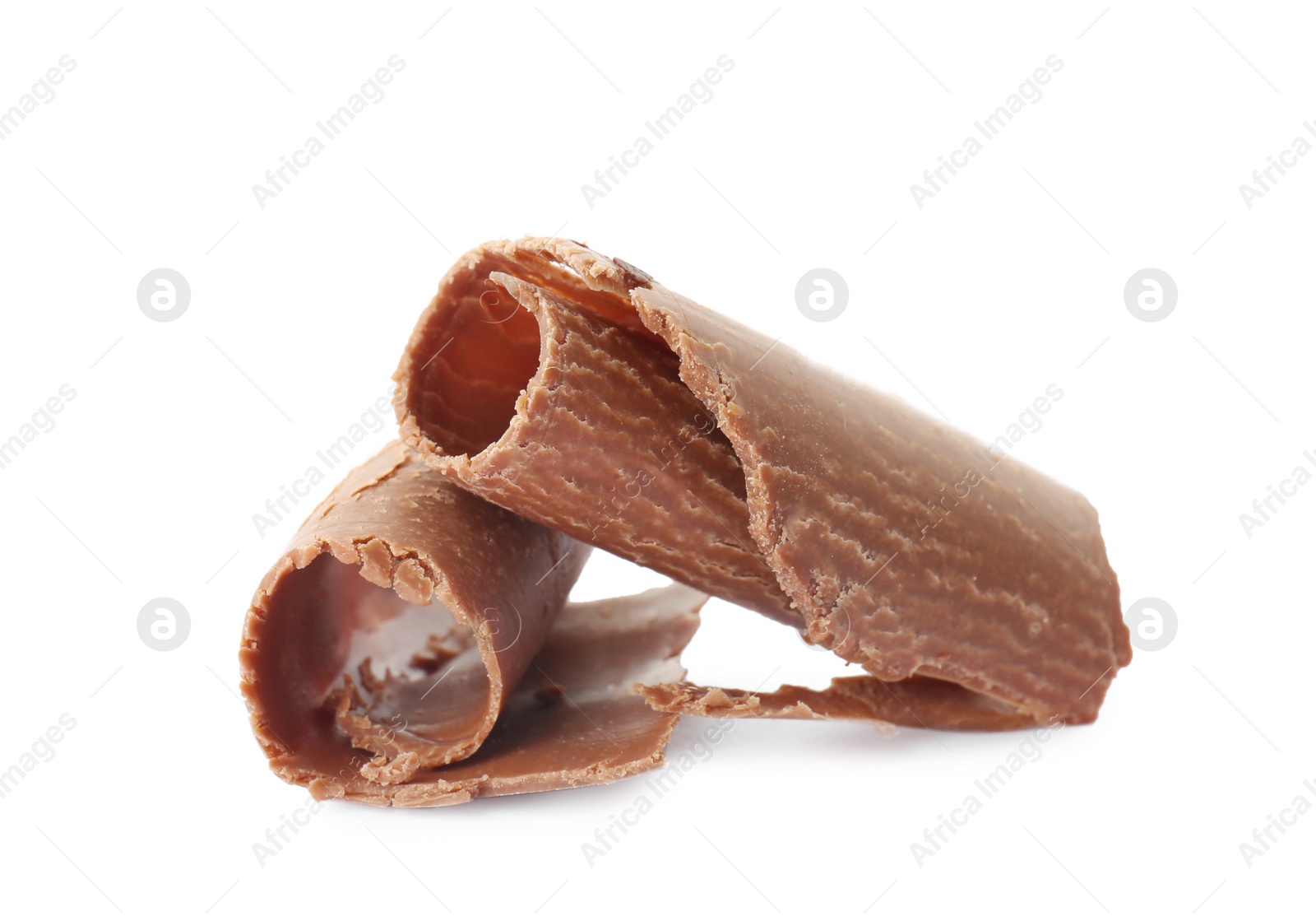 Photo of Delicious milk chocolate curls on white background