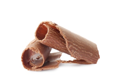 Photo of Delicious milk chocolate curls on white background