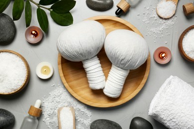 Photo of Flat lay composition with different spa products on light grey table