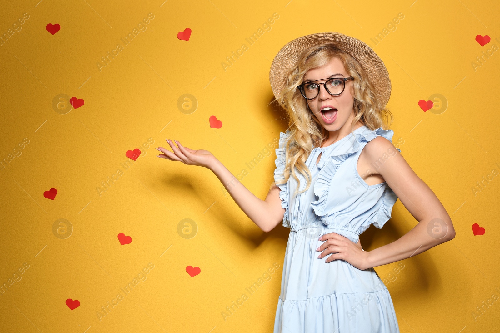 Photo of Emotional stylish young woman on color background