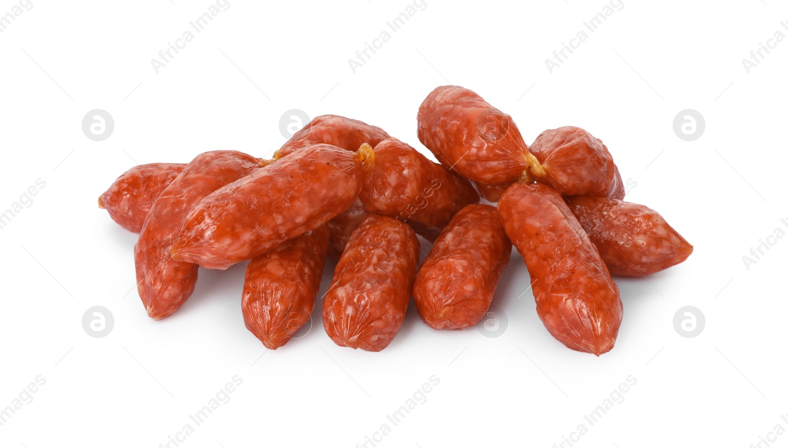 Photo of Many thin dry smoked sausages isolated on white