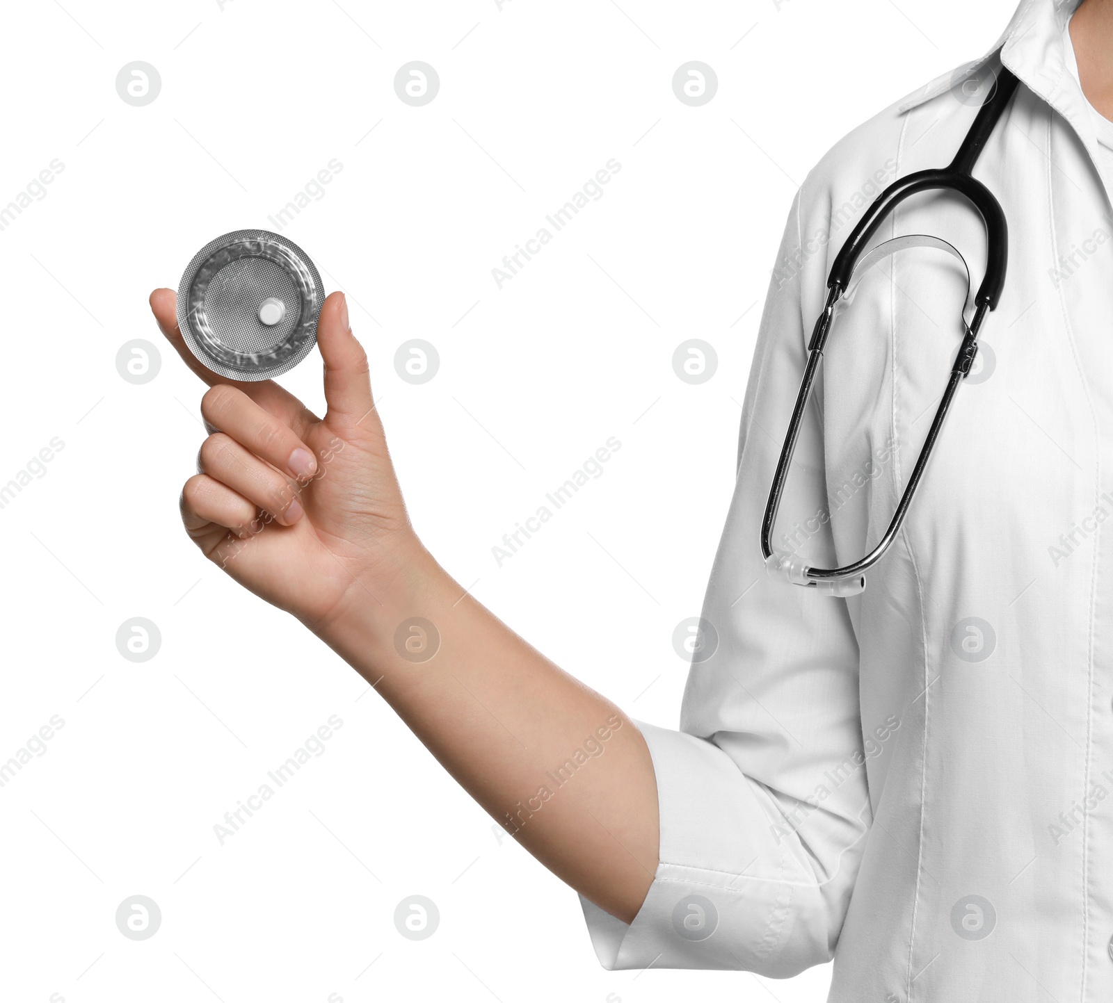 Photo of Doctor holding blister of emergency contraception pill on white background, closeup