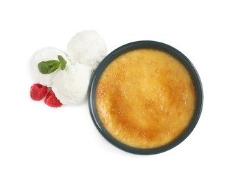 Photo of Delicious creme brulee with scoops of ice cream, fresh raspberries and mint on white background, top view