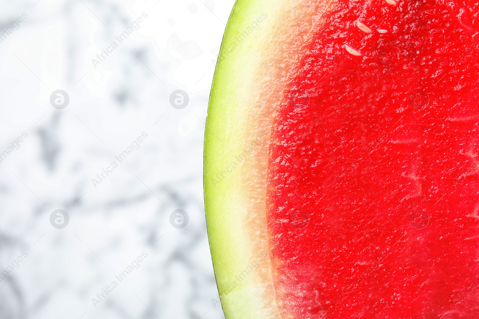 Photo of Slice of watermelon on light background, closeup