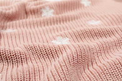 Texture of cozy warm sweater as background, closeup