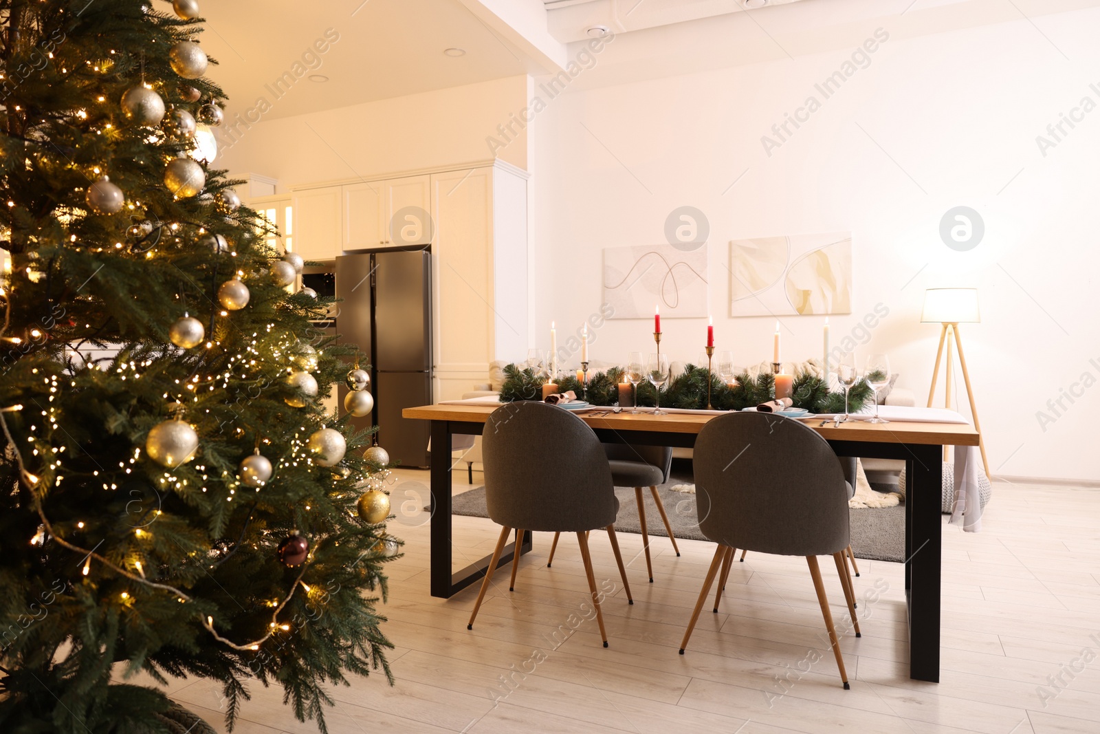 Photo of Cozy spacious kitchen decorated for Christmas. Interior design