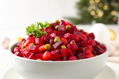 Traditional Russian salad vinaigrette in bowl, closeup