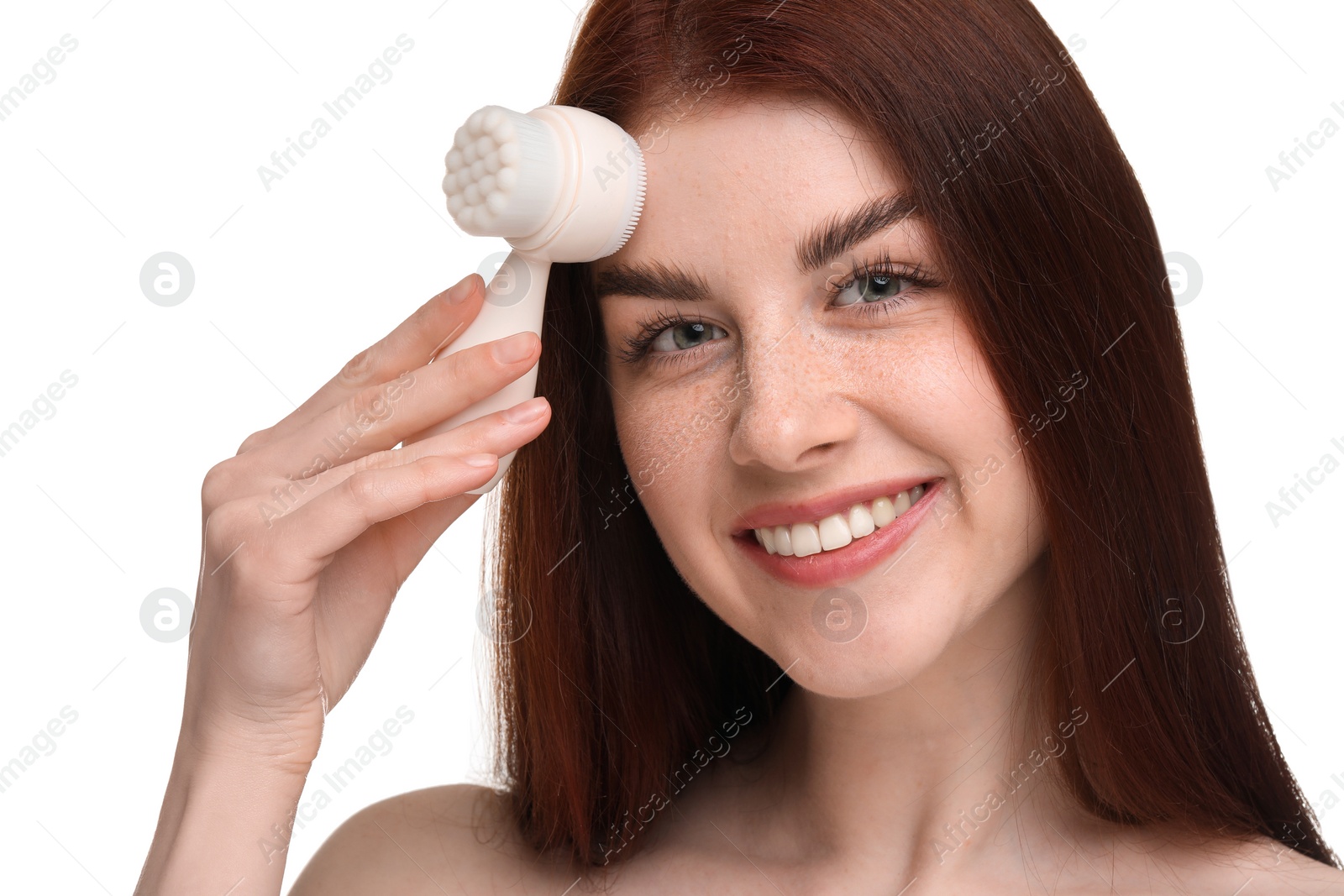 Photo of Washing face. Young woman with cleansing brush on white background