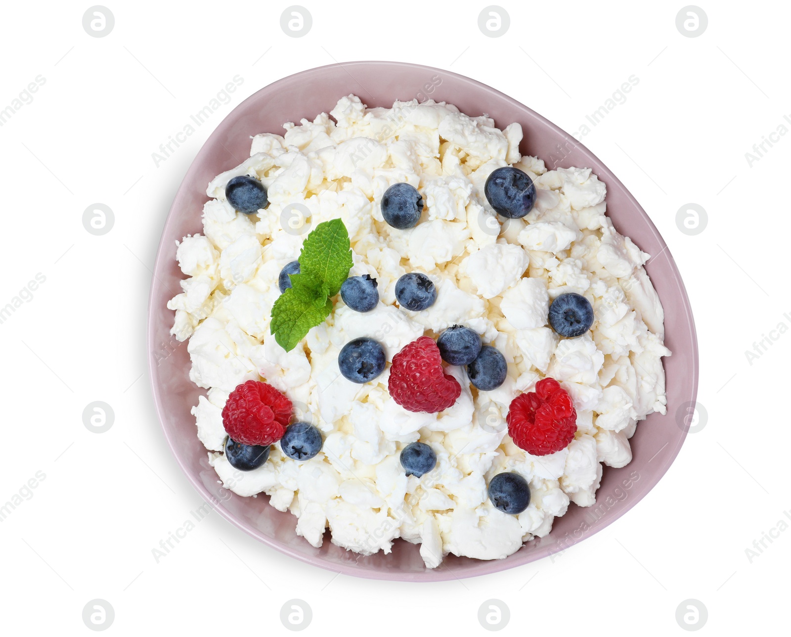 Photo of Fresh cottage cheese with berries and mint in bowl isolated on white, top view